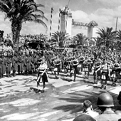 Photograph of pipers from the 51st Highland Division participating in the Allied victory parade through Tunis, May 1943 (Crown Copyright, National Records of Scotland, NSC1/394/52)