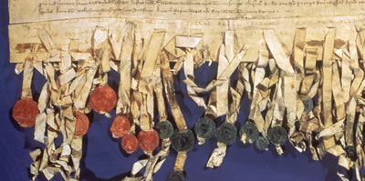 image showing part of the Declaration of Arbroath with some of the seals of earls and barons. 