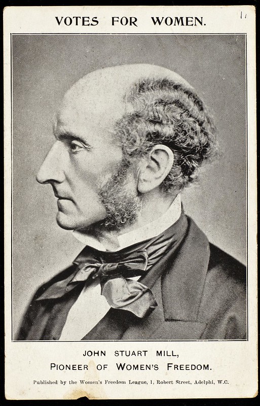 Portrait photograph of John Stuart Mill on a postcard with the words 'Votes for Women. John Stuart Mill, Pioneer of Women's Freedom'