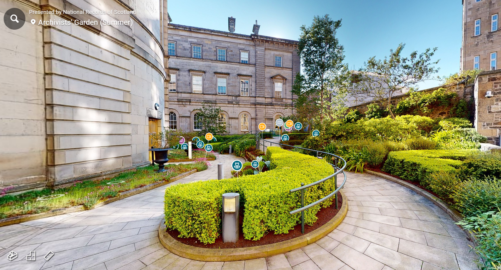 Photograph of the Archivists' Garden showing the surrounding buildings and plant life
