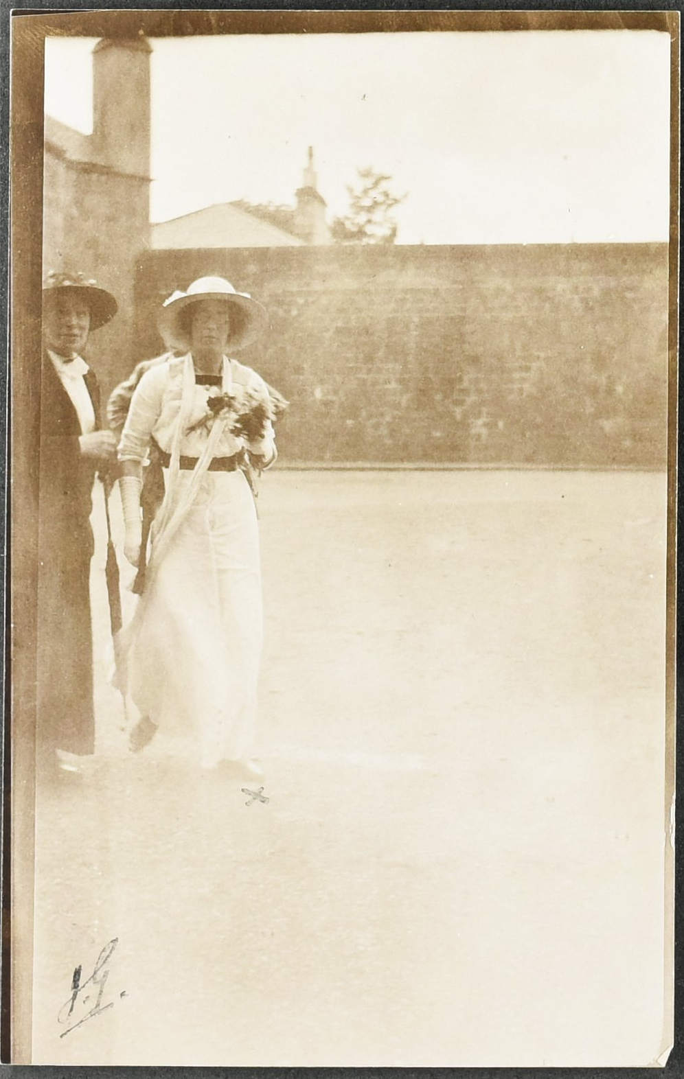 Photograph of Maude Edwards in a white dress with another woman by her side.